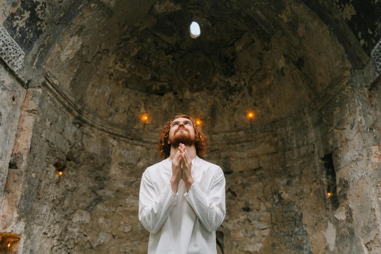 a man in a white shirt is praying, pexels contest winner, renaissance, grotto, asmongold, aphex twin, dmt temple