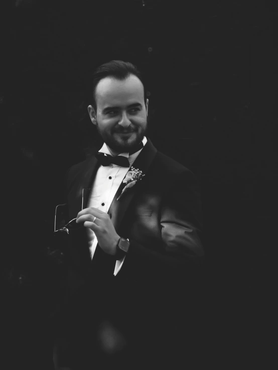 a black and white photo of a man in a tuxedo, inspired by Demetrios Farmakopoulos, pexels contest winner, jesse pinkman, diego fernandez, low quality grainy, gif