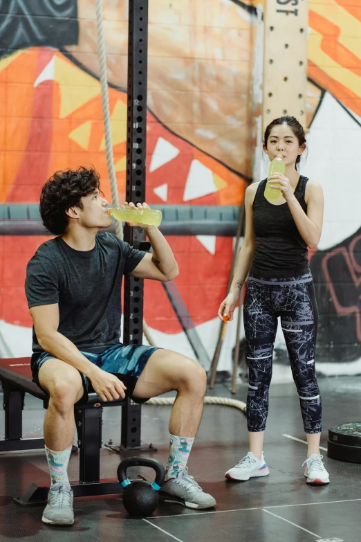 a man and a woman sitting on a bench in a gym, by John Luke, featured on instagram, renaissance, holding a drink, gemma chen, origin jumpworks, profile image