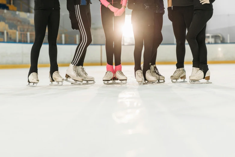 a group of people standing on top of an ice rink, trending on pexels, renaissance, thighs close up, inner glow, 🦩🪐🐞👩🏻🦳, studio photo
