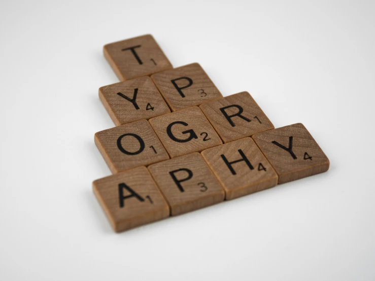 wooden scrabbles spelling ty ty ty ty ty ty ty ty ty ty ty ty, a macro photograph, unsplash, international typographic style, 1920s photograph, unsplash photo contest winner, pyrography, photography award winning
