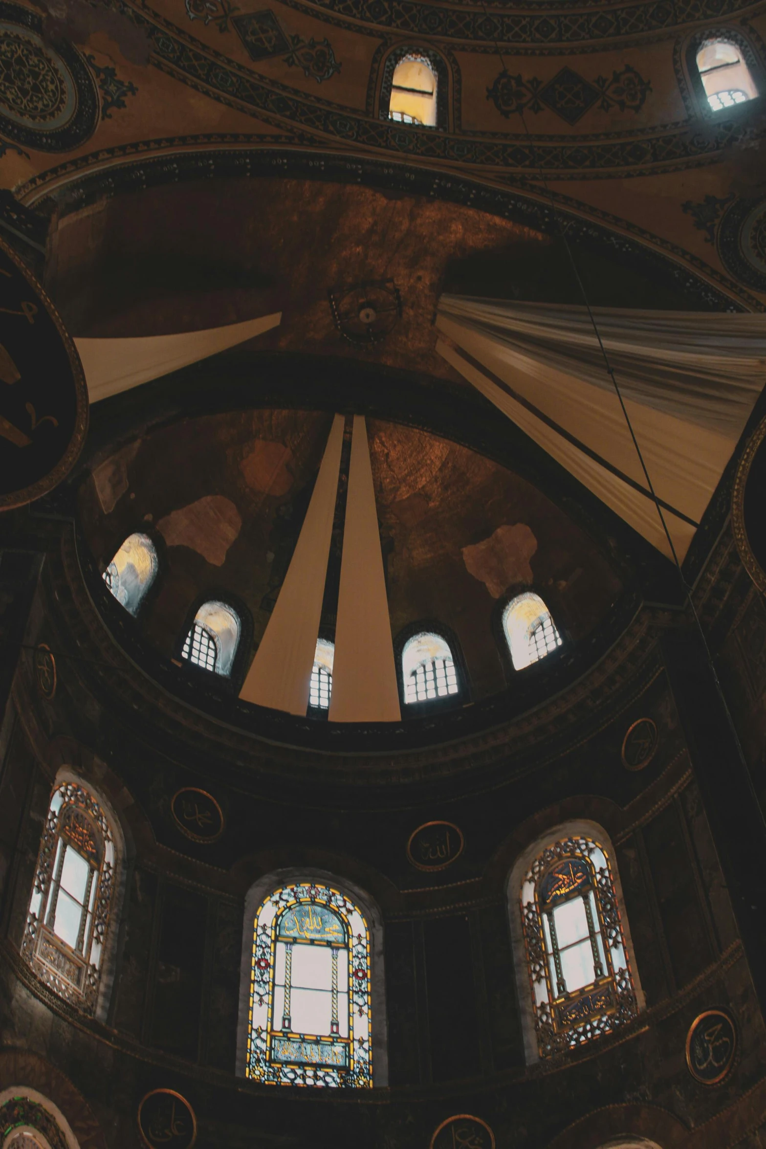the dome of a church with stained glass windows, unsplash contest winner, baroque, istanbul, low quality photo, panoramic, brown