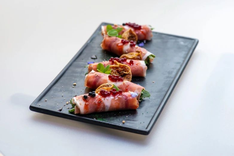 a close up of a plate of food on a table, bacon, bixbite, professional shot, asarotos oiko
