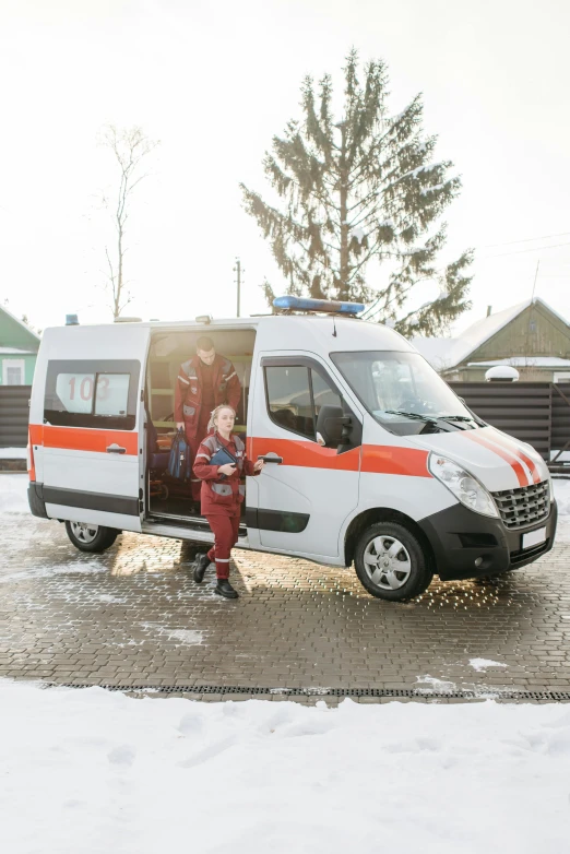 a small child standing in the doorway of an ambulance, by Adam Marczyński, pexels contest winner, hurufiyya, kama russian electrocar, square, full body 8k, winter