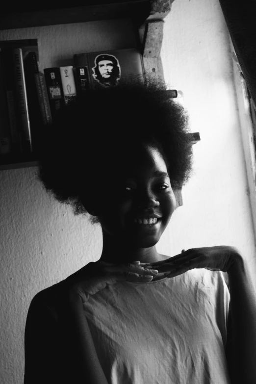 a black and white photo of a woman with an afro, pexels contest winner, smiling girl, glowing from inside, 🤤 girl portrait, adut akech