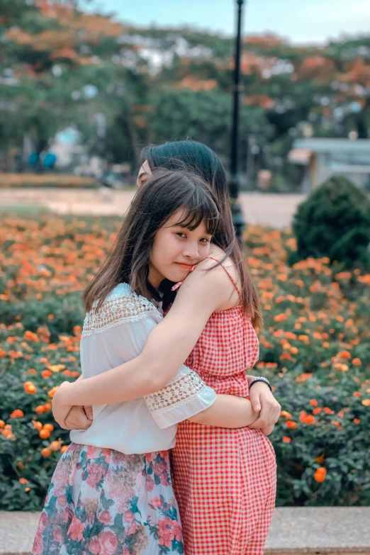 two girls hugging each other in a park, pexels contest winner, vietnamese woman, 15081959 21121991 01012000 4k, square, ruan cute vtuber
