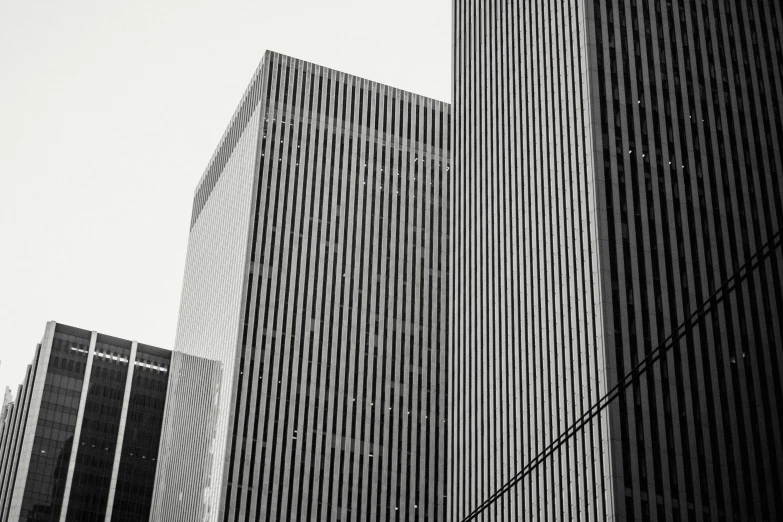 a black and white photo of some tall buildings, by Adam Rex, unsplash contest winner, postminimalism, square lines, gold, ny, scribbled lines