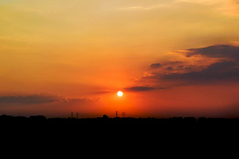 a person is flying a kite at sunset, by Jan Tengnagel, pexels contest winner, romanticism, panorama view of the sky, big red sun, from wheaton illinois, humid evening