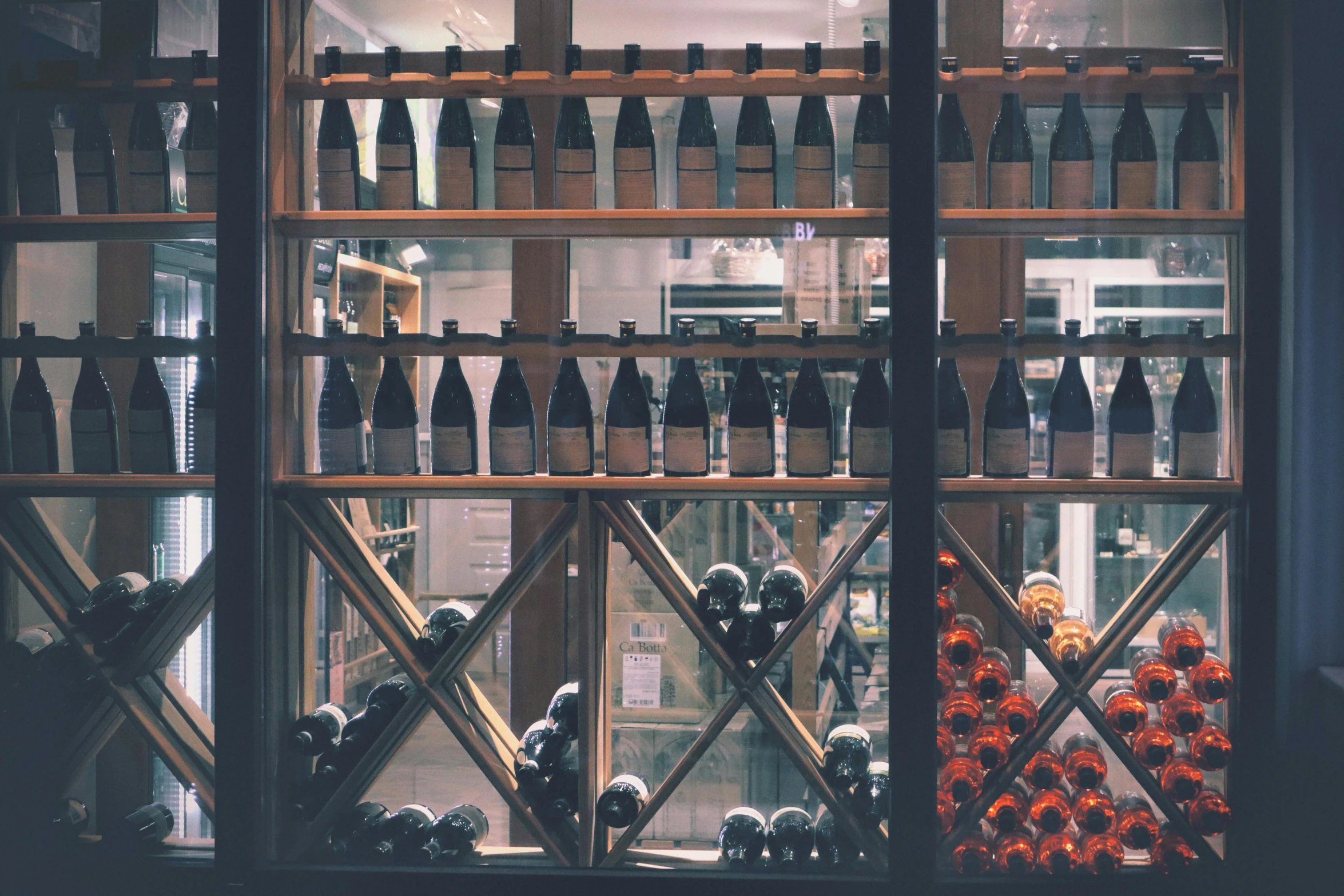 a window filled with lots of bottles of wine, by Carey Morris, pexels contest winner, shop front, lo fi, promo image, brown