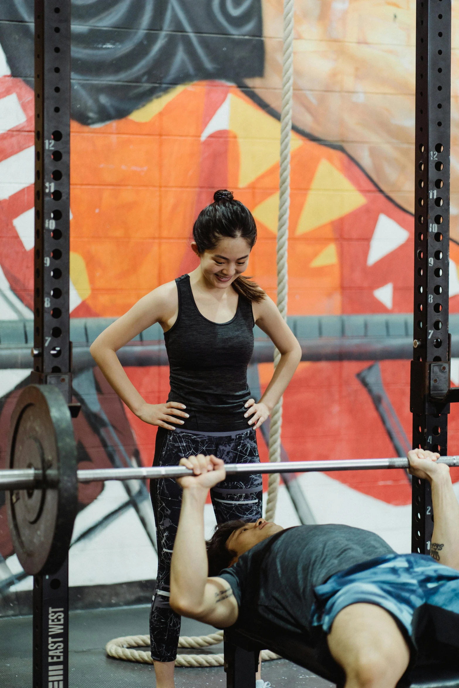 a couple of people that are in a gym, “ iron bark, louise zhang, lifting weights, jaime jasso