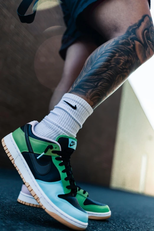 a man holding a tennis racquet on top of a tennis court, a tattoo, by Niko Henrichon, trending on pexels, acid-green sneakers, “air jordan 1, iridescent details, icon