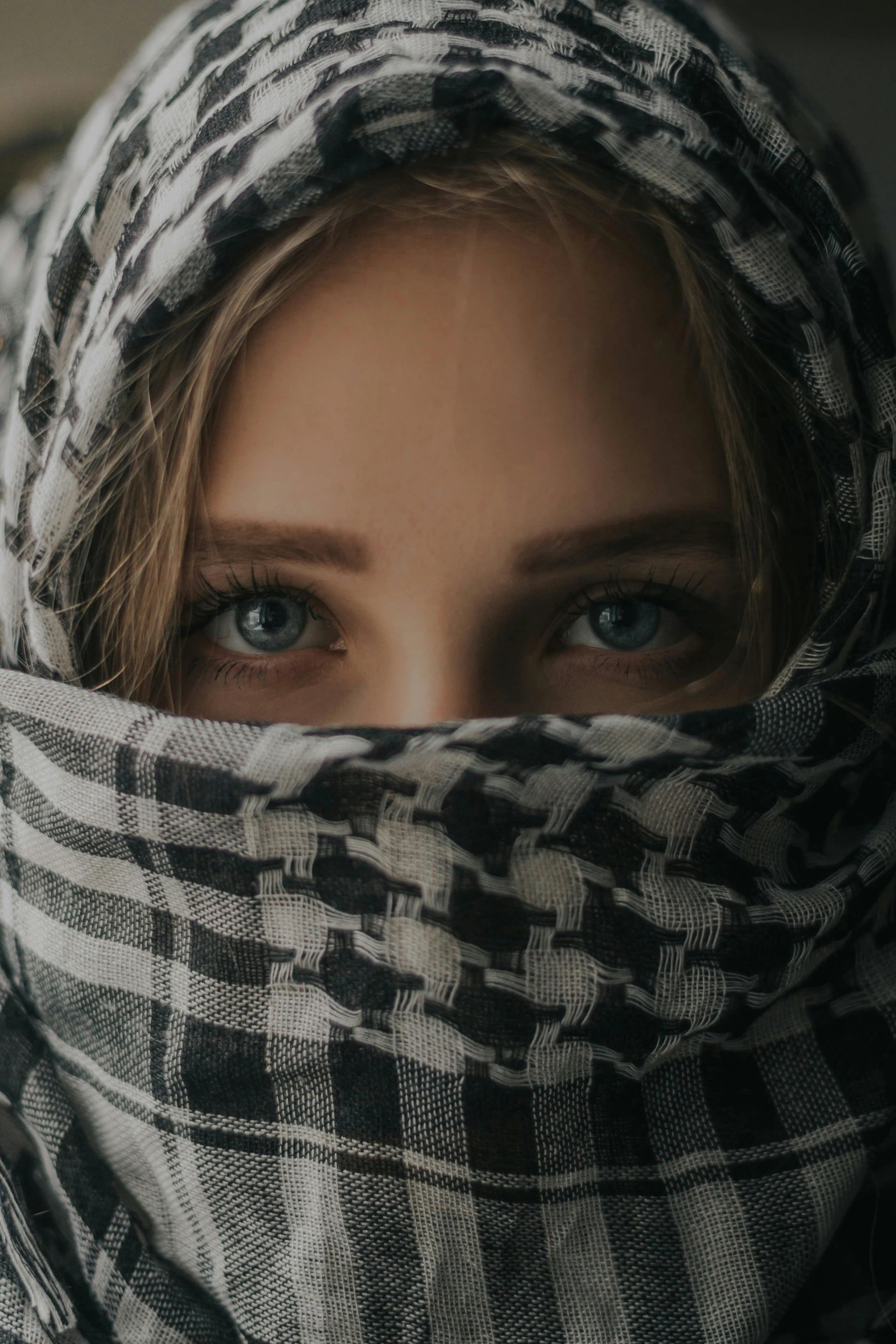 a close up of a person wearing a scarf, trending on unsplash, renaissance, burka, caucasian eyes, patterned, female spy