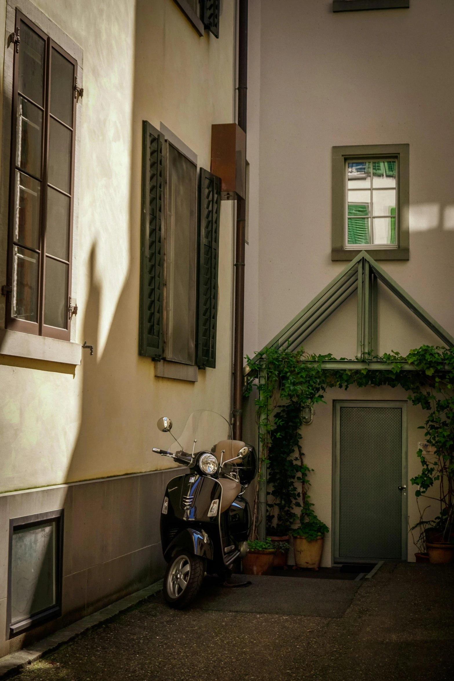 a motorcycle parked in front of a building, a picture, pexels contest winner, renaissance, green alley, well shaded, little windows, doorway