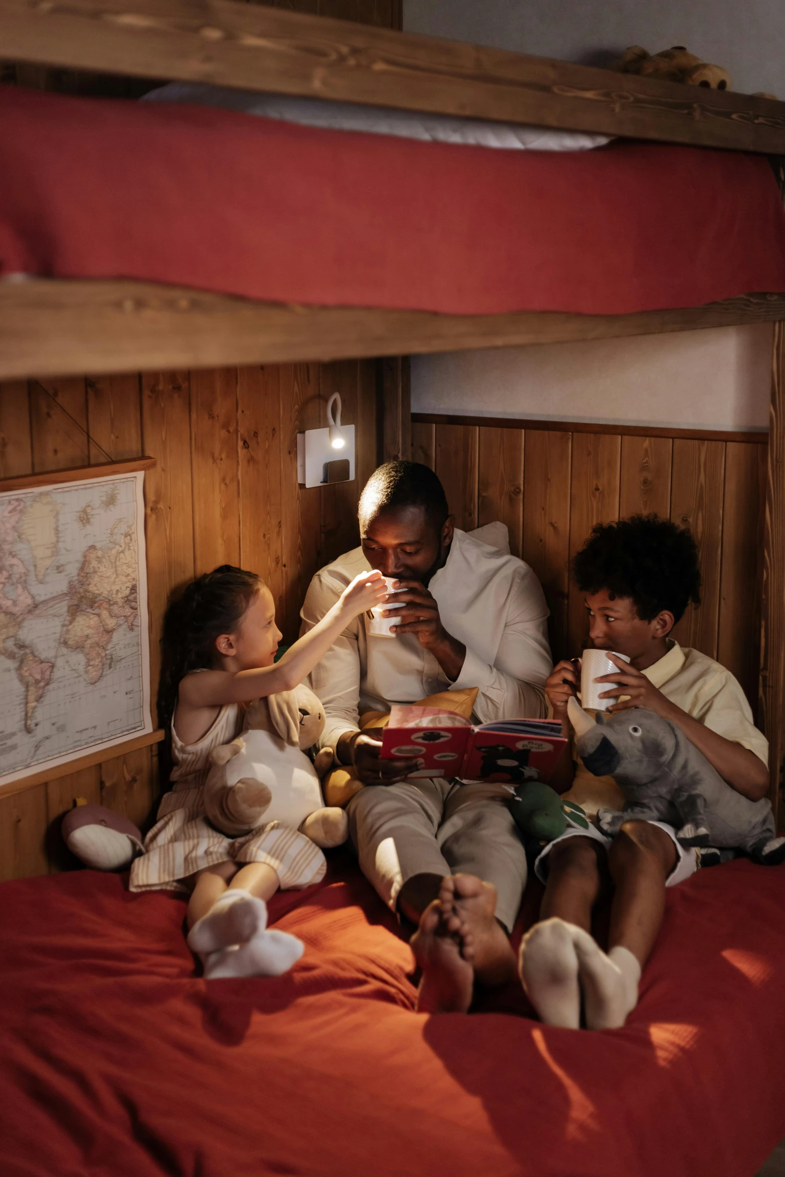 a couple of kids sitting on top of a bed, in a cabin, coffee, - 6