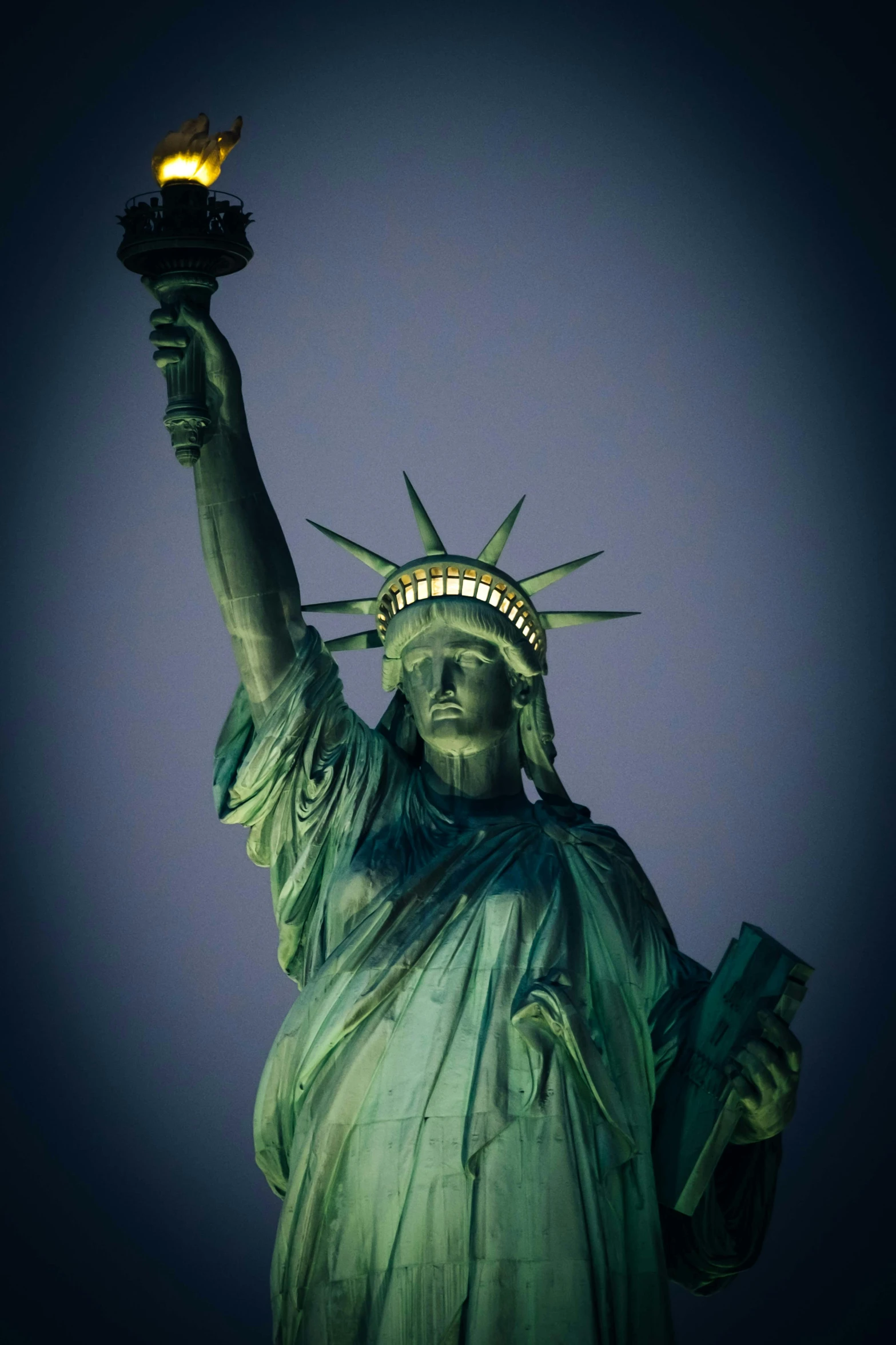 the statue of liberty is lit up at night, a statue, pexels contest winner, american romanticism, front closeup, 2022 photograph, made of bronze, slide show