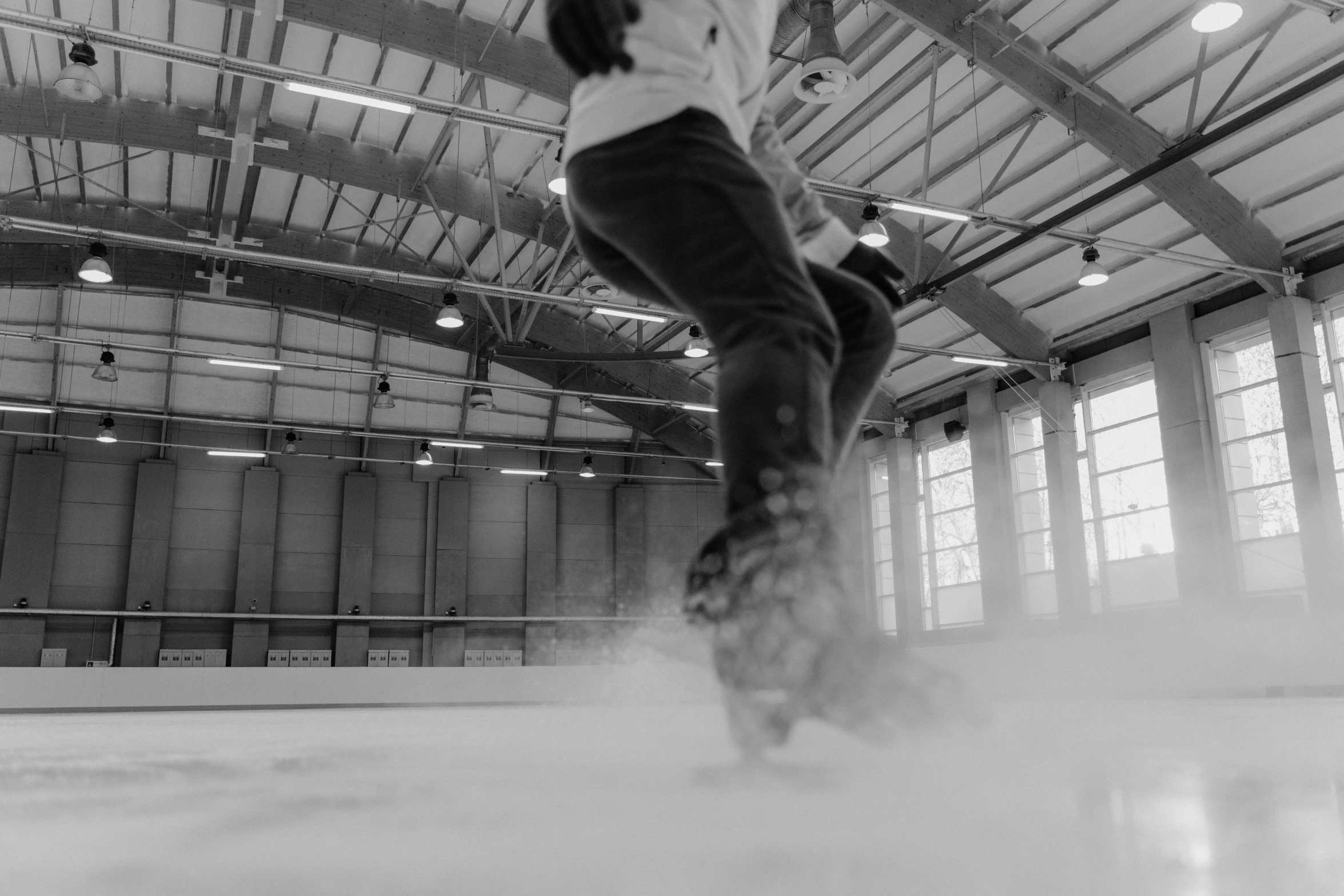 a black and white photo of a person on a skateboard, a black and white photo, by Emma Andijewska, unsplash contest winner, process art, made of ice, softplay, indoor, sport