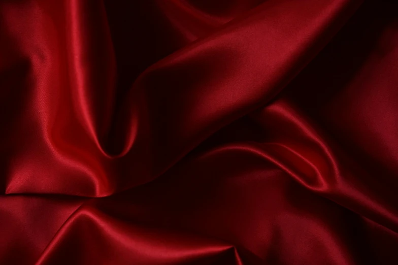 a close up of a red satin fabric