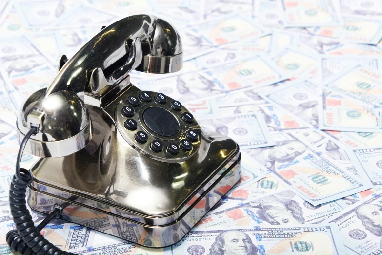 a telephone sitting on top of a pile of money, thumbnail, telephone, seventies, hyperrealistic