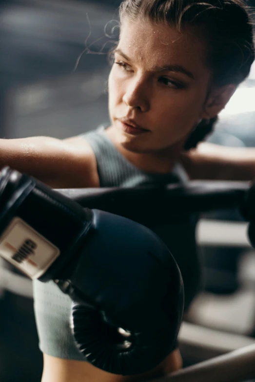 a close up of a person wearing boxing gloves, profile image, thrusters, thumbnail, focused on her neck