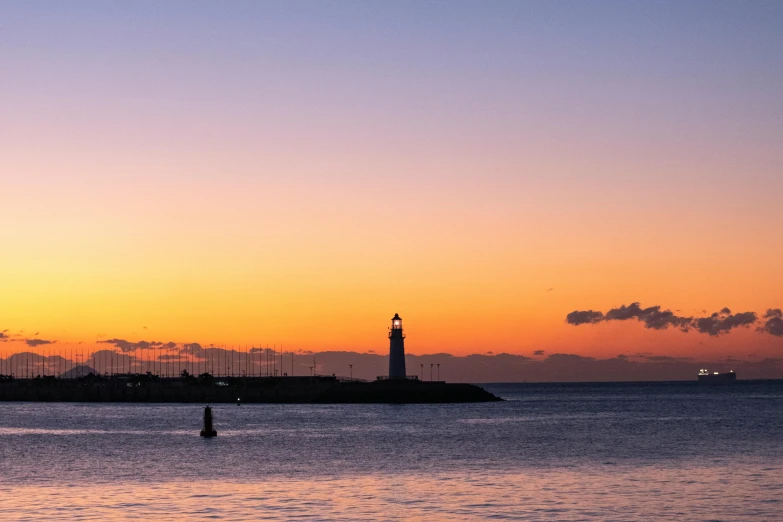 a large body of water with a lighthouse in the distance, by Niko Henrichon, pexels contest winner, romanticism, pastel sunset, caulfield, split near the left, port scene background
