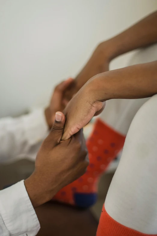 a man putting a ring on a woman's finger, hurufiyya, clinical, color photograph, madagascar, 4k photo”