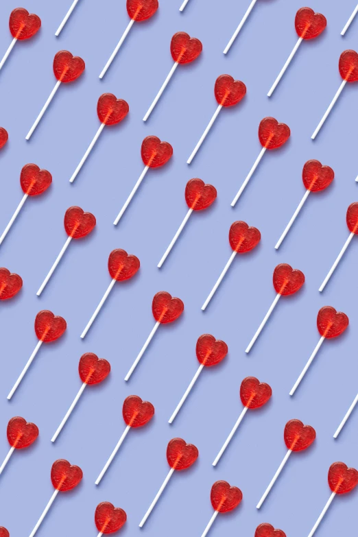 a lot of lollipops in the shape of hearts, an album cover, pexels, pop art, blue, solid background, dating app icon, maroon