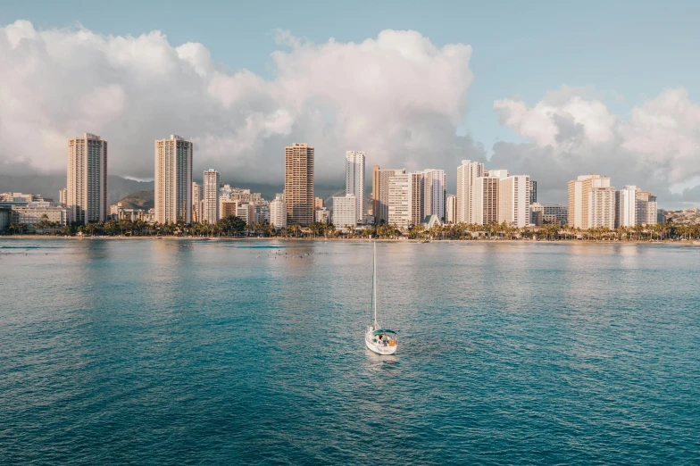 a sailboat in the middle of a large body of water, by Austin English, unsplash contest winner, hurufiyya, waikiki beach skyline, detailed high resolution, high angle uhd 8 k, lachlan bailey