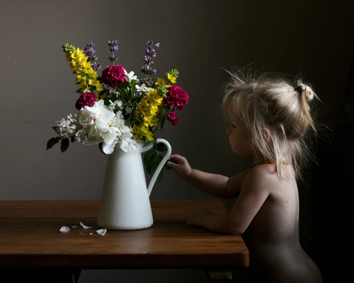 a little girl sitting at a table with a vase of flowers, inspired by Frieke Janssens, shutterstock contest winner, process art, shot on sony alpha dslr-a300, 4yr old, nsfw, medium format. soft light