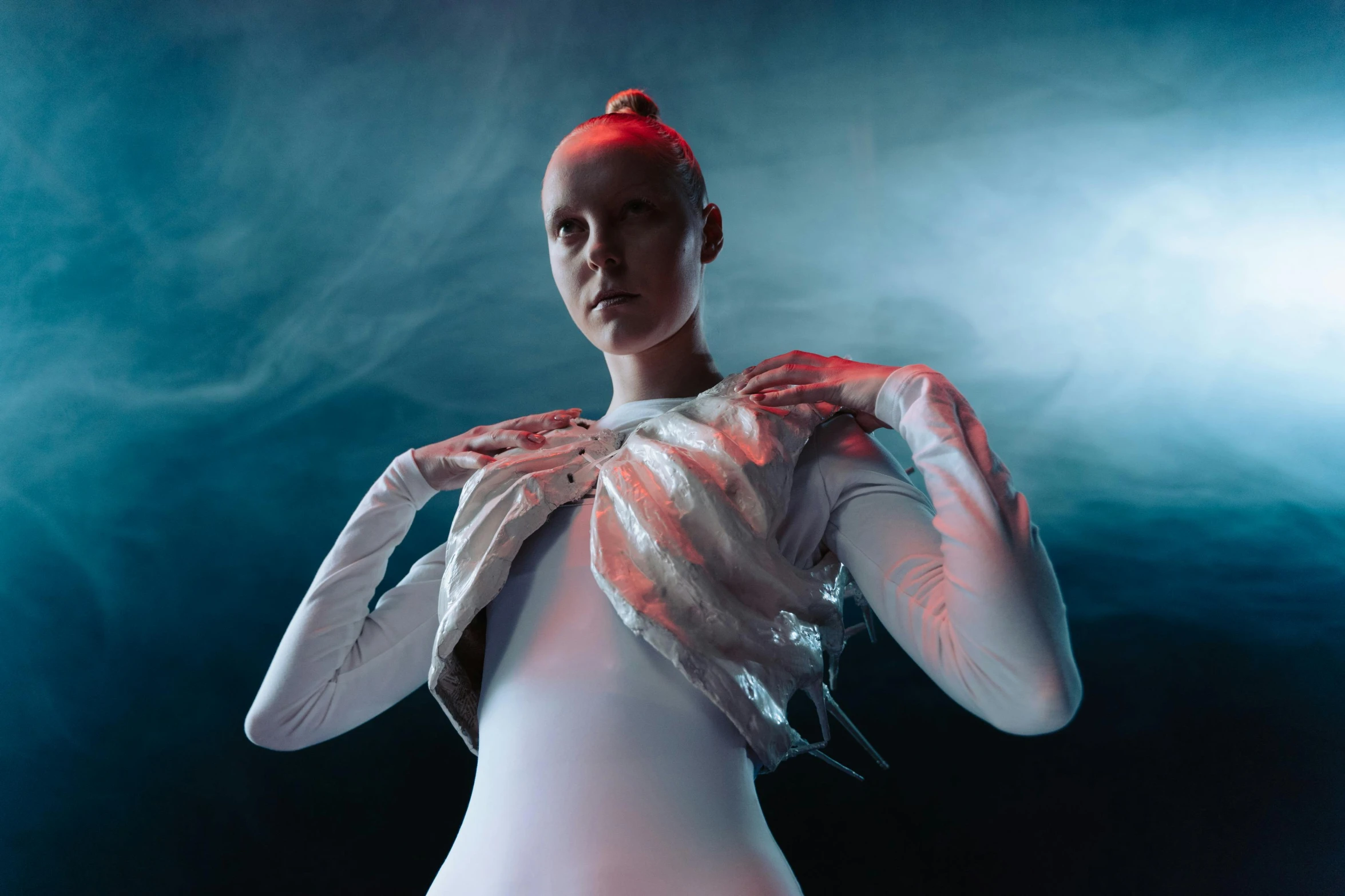 a close up of a person in a body suit, an album cover, inspired by Ignacy Witkiewicz, renaissance, wearing futuristic clothing, dress made of water, posing in dramatic lighting, albino