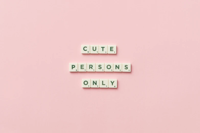 the words cute persons only spelled in scrabbles on a pink background, a picture, by Olivia Peguero, trending on pexels, aestheticism, on a pale background, nendoroid, clean minimalist design, cut out