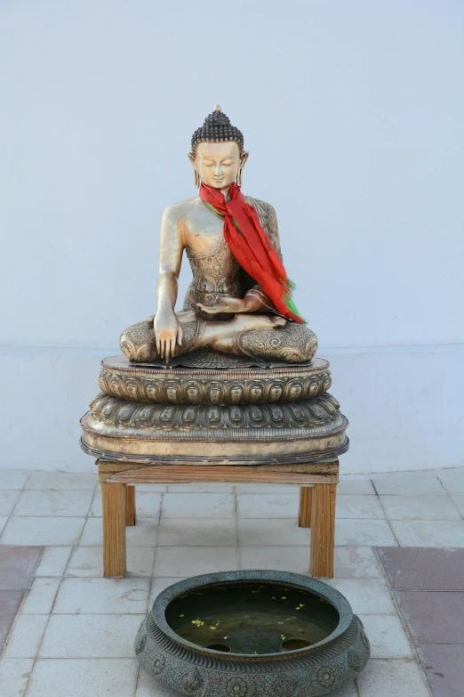 a statue of a person sitting on a bench, samsara, sitting on the floor, upright, thawan duchanee