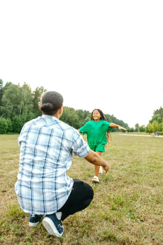 a man and a little girl playing frisbee in a field, pexels contest winner, visual art, 268435456k film, rectangle, a green, low quality photo