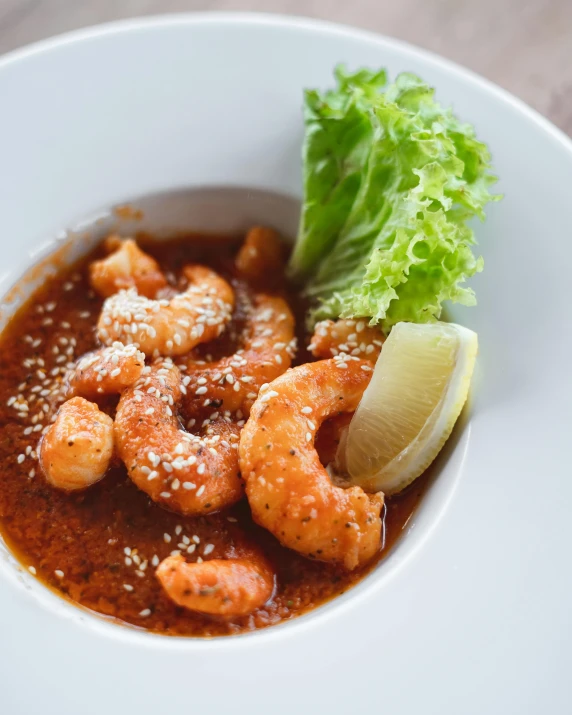 a white plate topped with shrimp and lettuce, a cartoon, unsplash, sumatraism, soup, charioscuro, sparkly, attractive photo