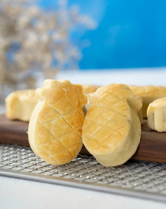 a close up of sliced bananas on a cutting board, inspired by Nishida Shun'ei, dau-al-set, animal - shaped bread, blue waffle cone, matt finish, carved soap