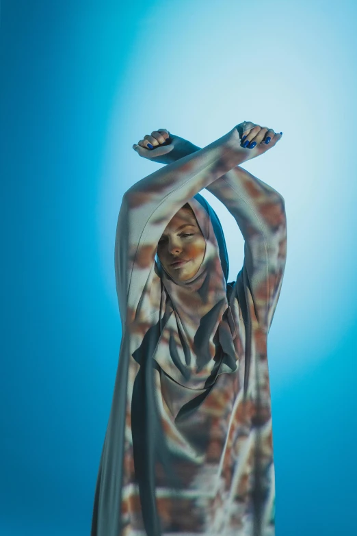 a statue of a woman holding a baseball bat, unsplash, hyperrealism, in dazzle camouflaged robes, hijab, blue toned, praying