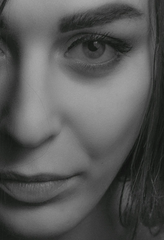 a black and white photo of a woman's face, staring seductively, album cover, exhausted face close up, desaturated