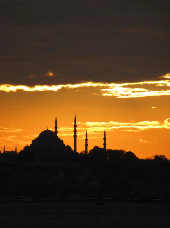 a sunset with a silhouette of a mosque in the distance, istanbul, overlooking, and, 8 x