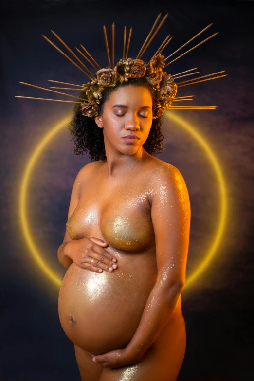 a pregnant woman with a halo on her head, an album cover, inspired by Anne Geddes, pexels contest winner, afrofuturism, gold bodypaint, halos, studio shoot, contest winner 2021