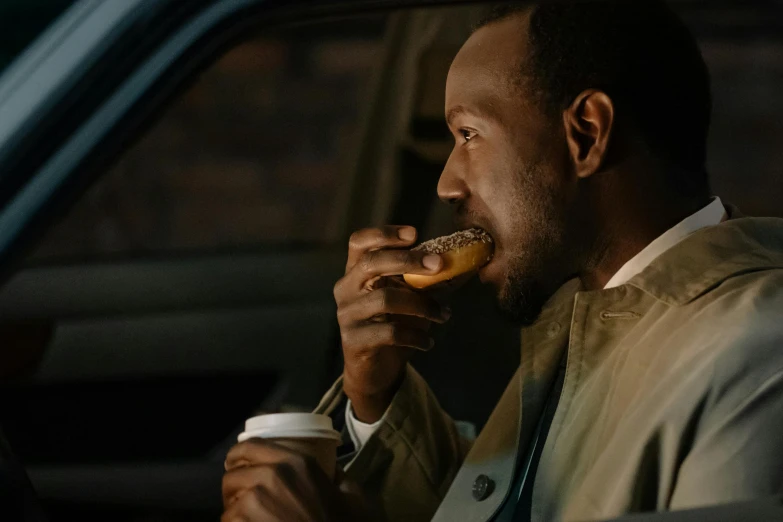 a man sitting in a car eating a donut, inspired by Richmond Barthé, pexels contest winner, dark skinned, portrait of morning coffee, people outside eating meals, profile image