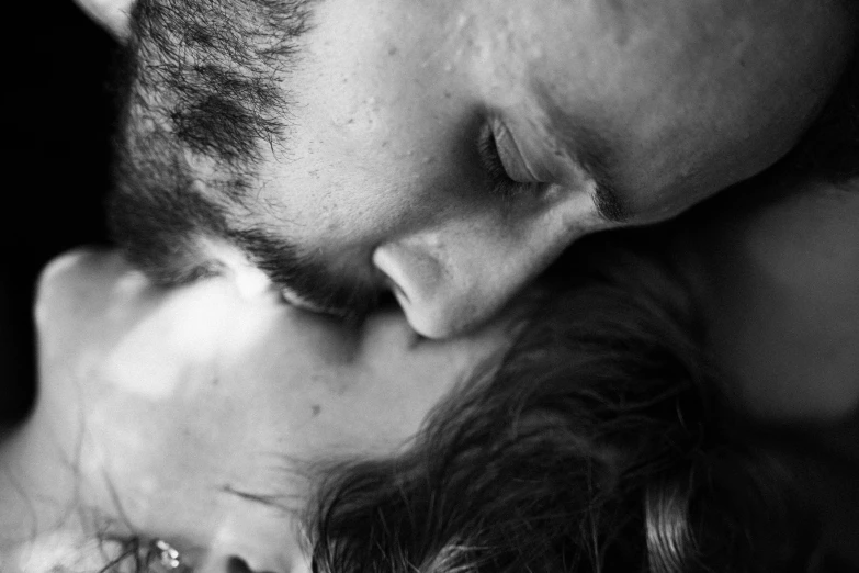 a black and white photo of a man kissing a woman, a black and white photo, by Caroline Mytinger, pexels, art photography, detailed and soft, a dream, maternal photography 4 k, photo realistic”