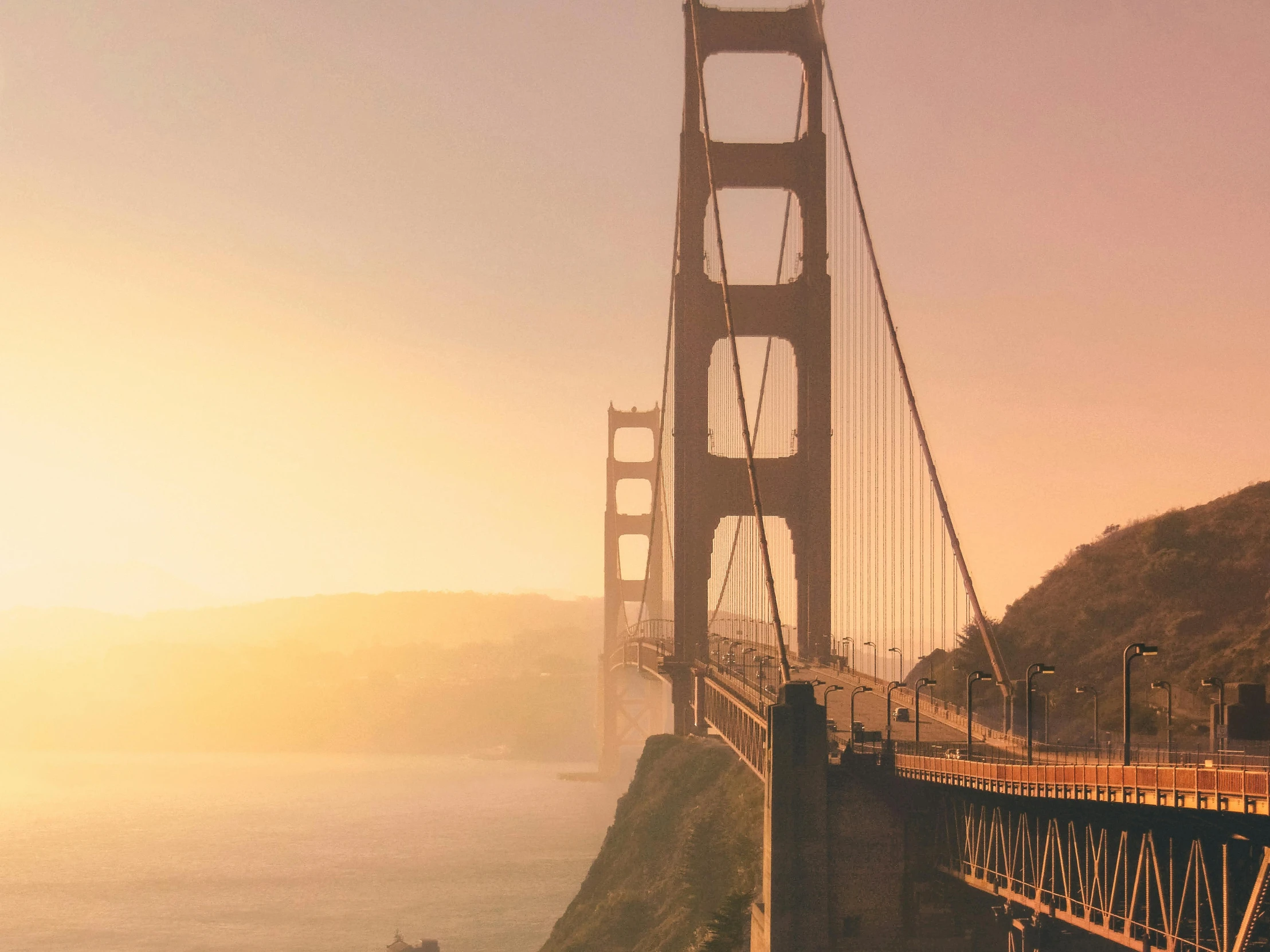 a view of the golden gate bridge in san francisco, california, pexels contest winner, modernism, background image, golden hues, frank moth, conde nast traveler photo