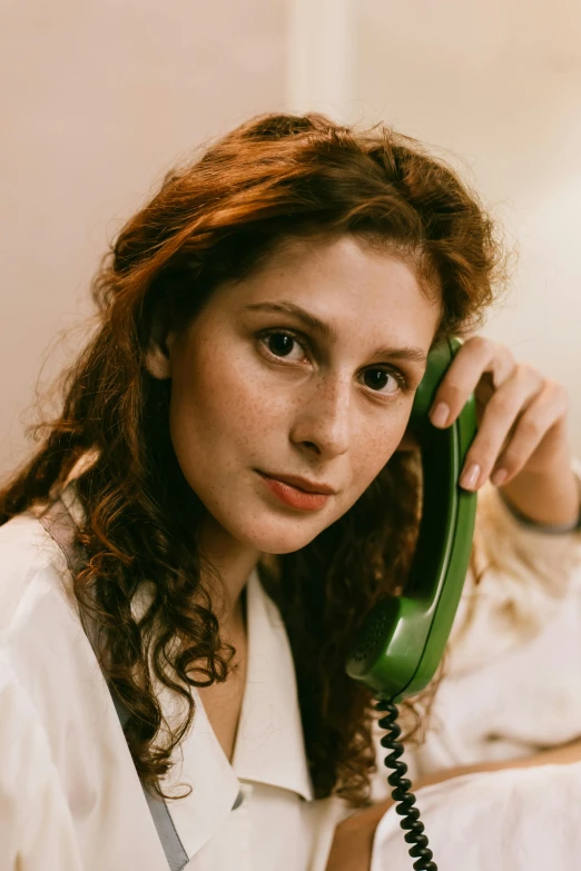 a woman holding a phone up to her ear, inspired by Nan Goldin, renaissance, lovingly looking at camera, girl making a phone call, promo image, meret elisabeth oppenheim