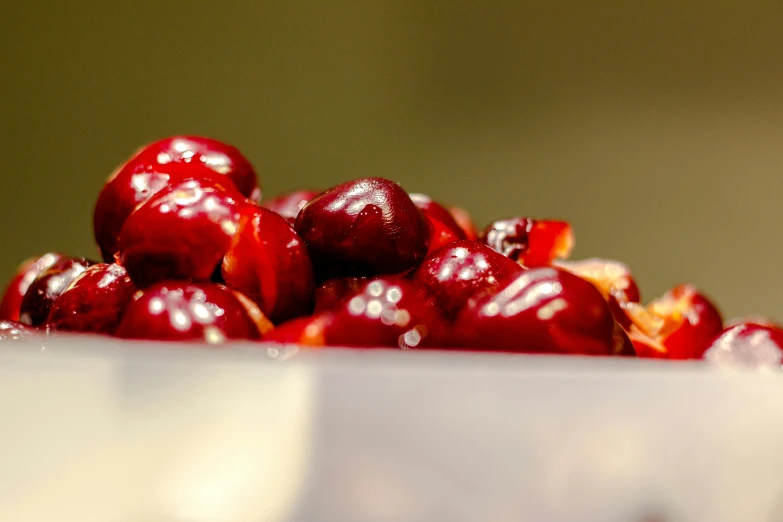 a close up of a bowl of cherries, by Matija Jama, pexels, partially bloody crystallized, avatar image, waist - shot, holiday