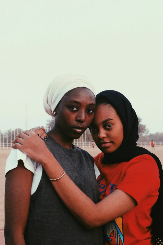 a couple of people standing next to each other, by Charly Amani, trending on unsplash, hurufiyya, high school girls, african ameera al taweel, late 2000’s, instagram picture