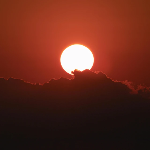 the sun is setting behind the clouds, pexels, big red sun, hot and humid, instagram post, taken in the late 2010s