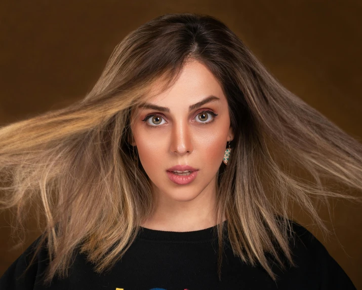 a woman with long hair standing in front of a brown background, by Julia Pishtar, pexels contest winner, ana de armas, better known as amouranth, gradient hair, beautiful iranian woman
