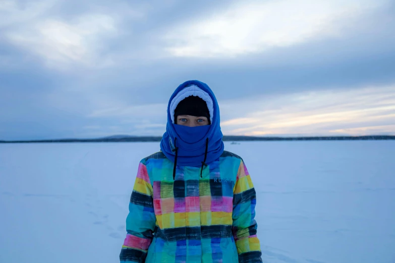 a person that is standing in the snow, an album cover, inspired by Louisa Matthíasdóttir, unsplash, ski masks, colorful clothing, near lake baikal, olafur eliasson