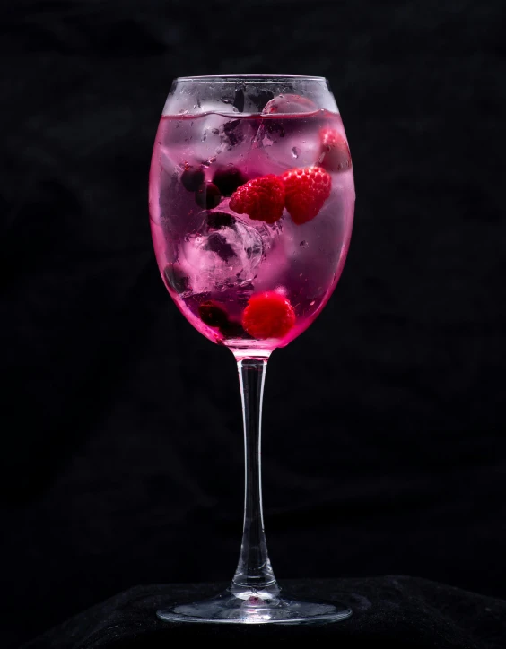 a wine glass filled with raspberries and ice, inspired by Wlodzimierz Tetmajer, pexels contest winner, renaissance, pink and purple, cocktail bar, portrait n - 9, magenta and gray