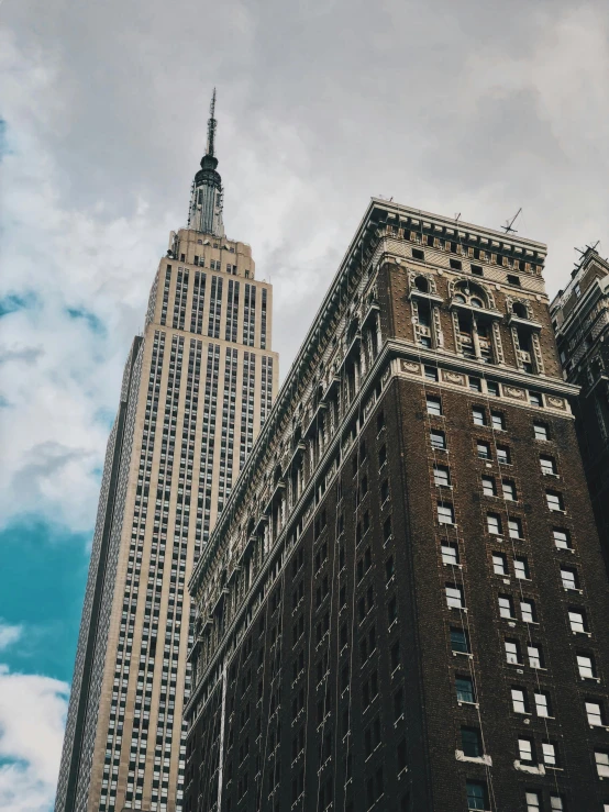 a very tall building in a big city, unsplash contest winner, fan favorite, americana architecture, low quality photo, 2 0 0 0's photo