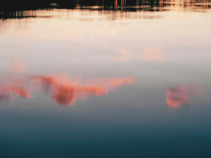 a body of water that has some clouds in it, a picture, inspired by Elsa Bleda, unsplash, aestheticism, pink reflections, golden hour closeup photo, color ( sony a 7 r iv, mirrored